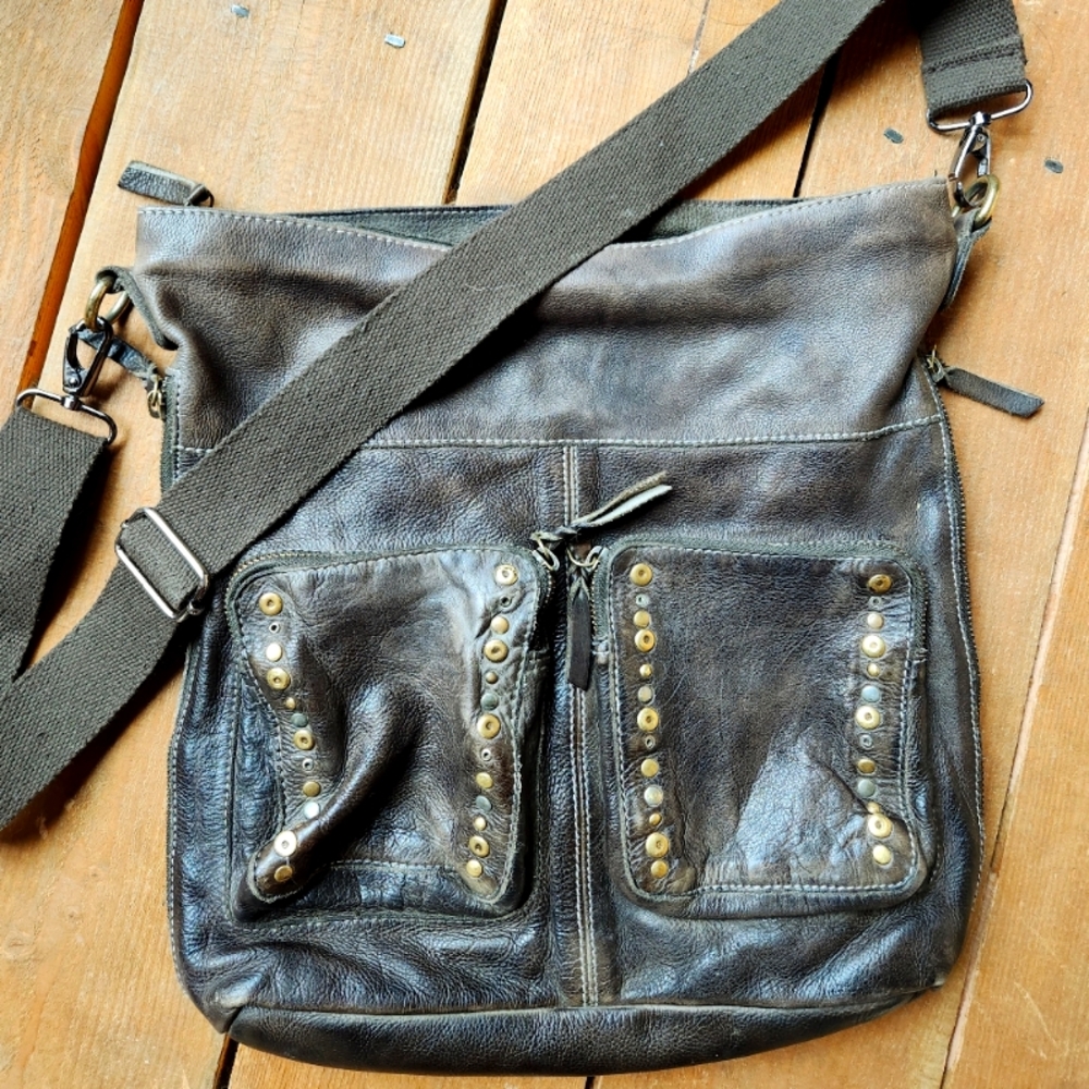 Dark olive green cross over bag through Sundance. Rich leather. Studded